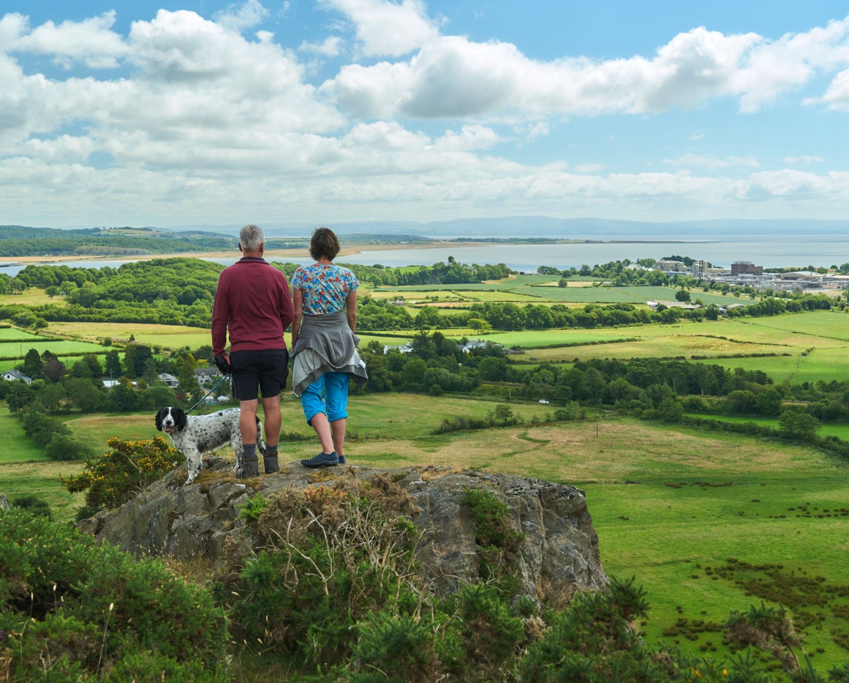 Two Walkers With Dog Looking Across Morecambe Bay From Path To The Hoad Wildey Media Scaled